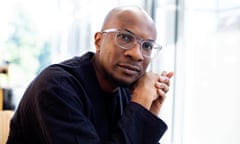 Cambridge, MA -- Writer and photographer Teju Cole poses for a portrait at the Cambridge Public Library, where he often visits to research and write, on October 2, 2023, in Cambridge, Massachusetts. (photo by Kayana Szymczak for The Observer)