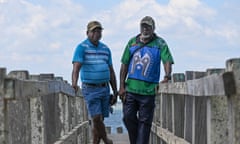 Pabai Pabai, left, and Paul Kabai, right, look out from Boigu Island in Australia's Torres Strait.