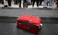 Travellers wait at a baggage claim carousel at Melbourne airport