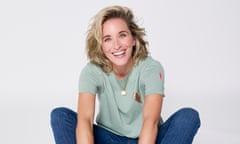 Vicky McClure in dark blue jeans, a pale green, short-sleeved T-shirt and white trainers, sitting on the floor