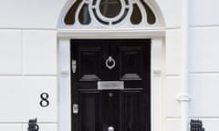 Georgian door with fanlight frame<br>The front view of a Georgian door topped by a glass fanlight frame in London