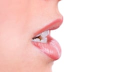 Closeup of a woman’s lips talking.