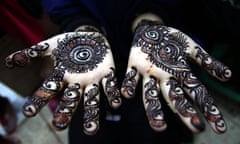 Eid al-Fitr preparations in Pakistan<br>epa05408940 A Pakistani girl let the Henna tattoo dry ahead of the biggest Muslim Festival, Eid al-Fitr, to mark the end of Ramadan, in Karachi, Pakistan, 05 July 2016. Muslims around the world celebrate the holy month of Ramadan by praying during the night time and abstaining from eating and drinking during the period between sunrise and sunset. Ramadan is the ninth month in the Islamic calendar and it is believed that the Koran's first verse was revealed during its last 10 nights. EPA/SHAHZAIB AKBER