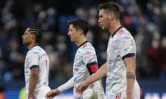 Bayern's Serge Gnabry, Bayern's Robert Lewandowski and Bayern's Niklas Suele, from left, leave the pitch disappointed after losing the German Bundesliga soccer match between VfL Bochum and Bayern Munich in Bochum, Germany, Saturday, Feb. 12, 2022. (AP Photo/Martin Meissner)