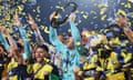 Danny Vukovic raises the Championship Trophy after Central Coast Mariners won the A-League Grand Final.