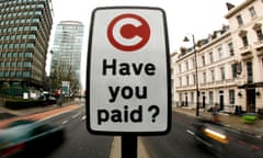 A congestion charge pay reminder sign