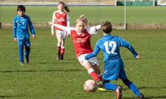 Up for the challenge: the Arsenal Women under-10s team play a match against the AC Finchley boys team.