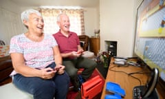 Julie and Andy Mason enjoy a video game.