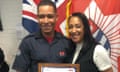 Jaden with his mum, Linda, holding a certificate after passing his training to be a firefighter