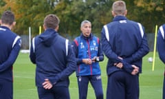 Chris Hughton talks to the Nottingham Forest players at training