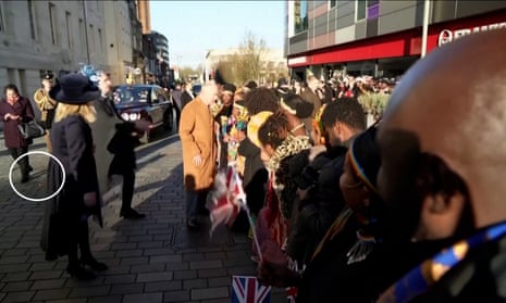 King Charles steered away from crowds by security after egg allegedly thrown – video