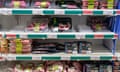 Fridge aisle of a supermarket with meats, including lamb, pork and beef