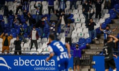 Deportivo de la Coruña’s socially distanced fans celebrate as Eneko Bóveda wheels away after scoring their injury time winner. 