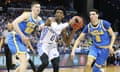 Kentucky’s De’Aaron Fox drives between Lonzo Ball, right, and TJ Leaf, left. Fox scored 39 points as the Wildcats won 86-75.