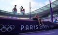 Athletes train at the Stade de France on track familiarisation day.