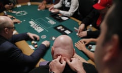 Stressful hand … a player gets a message during the first day of the World Series of Poker in Las Vegas last week.