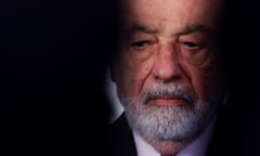 Carlos Slim pictured between the shadows of two other people in the foreground
