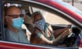 Voters wear masks at the Maricopa county elections department in Phoenix, Arizona, on 15 October 2020.