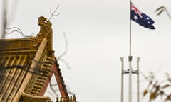 The flag pole of the Australian Parliament is seen behind the roofs of the Chinese Embassy in Canberra, 