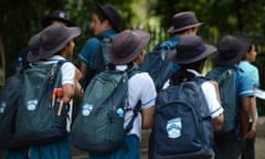 A group of high school students walk together during an excursion