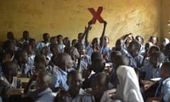 Kenya. Refugees from Kakuma pose with the TedX logo<br>School children pose with the TedX logo in a classroom at their school in Kakuma Refugee Camp in Kenya.