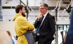 Chris McEwan (right), Labour’s candidate for the Tees Valley mayoral election on 2 May, speaks to Ory Vanes, a deli owner in Darlington’s market. 