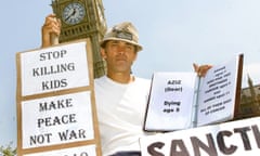 Brian Haw pictured in Westminster in 2001, holding banners at his protest camp