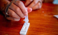 A woman does a lateral flow test for coronavirus at home.