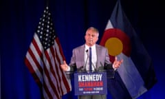 Robert F Kennedy Jr stands at a podium during a campaign rally