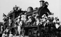 Hundreds of Muslim refugees in Delhi pack inside and atop the engine and coaches of a Pakistan-bound train on 27 September 1947.