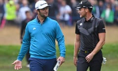 Danny Willett (right) held off the challenge of Jon Rahm, whose hopes ended in the water on the 18th hole.