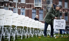 Relatives of victims of the MH17 crash hold a silent protest in front of the Russian embassy in The Hague