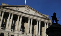 A statue is silhouetted against the Bank of England in the City of London, Britain, December 12, 2017.