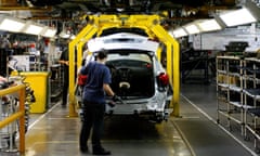 A Vauxhall worker builds a car at Ellesmere Port