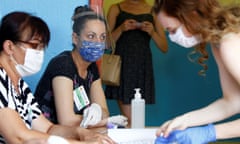 Electoral commission members wear face masks at a polling station in Strumica during North Macedonia’s general election on Wednesday.