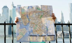 Woman holding map in Brooklyn, New York City, USA.