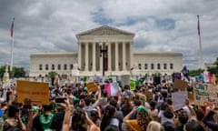 People protest in response to the Dobbs v Jackson Women's Health Organization ruling on 24 June 2022.