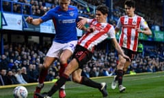 George Dobson of Sunderland tackles Cameron McGeehan of Portsmouth in their EFL Sky Bet League One match at Fratton Park on 1 February 2020