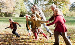 Extended family running in park