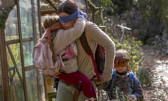 Vivien Lyra Blair,Sandra Bullock,Julian Edwards<br>This image released by Netflix shows Sandra Bullock in a scene from the film, “Bird Box.” Netflix’s post-apocalyptic survival film is drawing criticism for using footage of a real fiery train disaster but the streaming giant has no plans to remove it. The footage concerns a 2013 tragedy in the Quebec town of Lac-Megantic when an unattended train carrying crude oil rolled down an incline, came off the tracks and exploded into a massive ball of fire, killing 47 people. (Saeed Adyani/Netflix via AP)