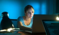 Beautiful woman working late at night in office, surfing the web and writing post on social network with laptop computer. The gi<br>ER4RGH Beautiful woman working late at night in office, surfing the web and writing post on social network with laptop computer. The gi