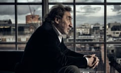 Howard Jacobson sitting at home in London beside a window