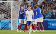 Paxten Aaronson of the US reacts as Michael Olise celebrates scoring France’s second goal. 