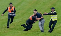 Epsom Races<br>EPSOM, ENGLAND - JUNE 03: A protester runs onto the course and is tackled to the ground on Derby Day at Epsom Racecourse on June 03, 2023 in Epsom, England. (Photo by Alan Crowhurst/Getty Images)