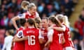 Leah Williamson leaps above her Arsenal teammates during a 5-1 win against Tottenham