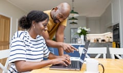 A couple using a laptop