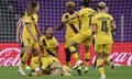 Barcelona’s Kheira Hamraoui (bottom left) celebrates with teammates after scoring against Atlético Madrid