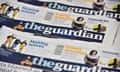 An arrangment of Guardian newspapers is photographed in an office in London on January 26, 2016. 
The Guardian newspaper is to cut running costs by 20 percent over three years and may begin charging for some online content following a 25-percent plunge in print advertising, British media reported Tuesday. / AFP / BEN STANSALLBEN STANSALL/AFP/Getty Images