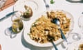 Chicken pilaf on a white plate on a table with a white tablecloth outdoors