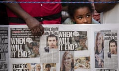  A young girl looks on as she attends a vigil for the victims of the recent mass shootings in El Paso, Texas and Dayton, Ohio